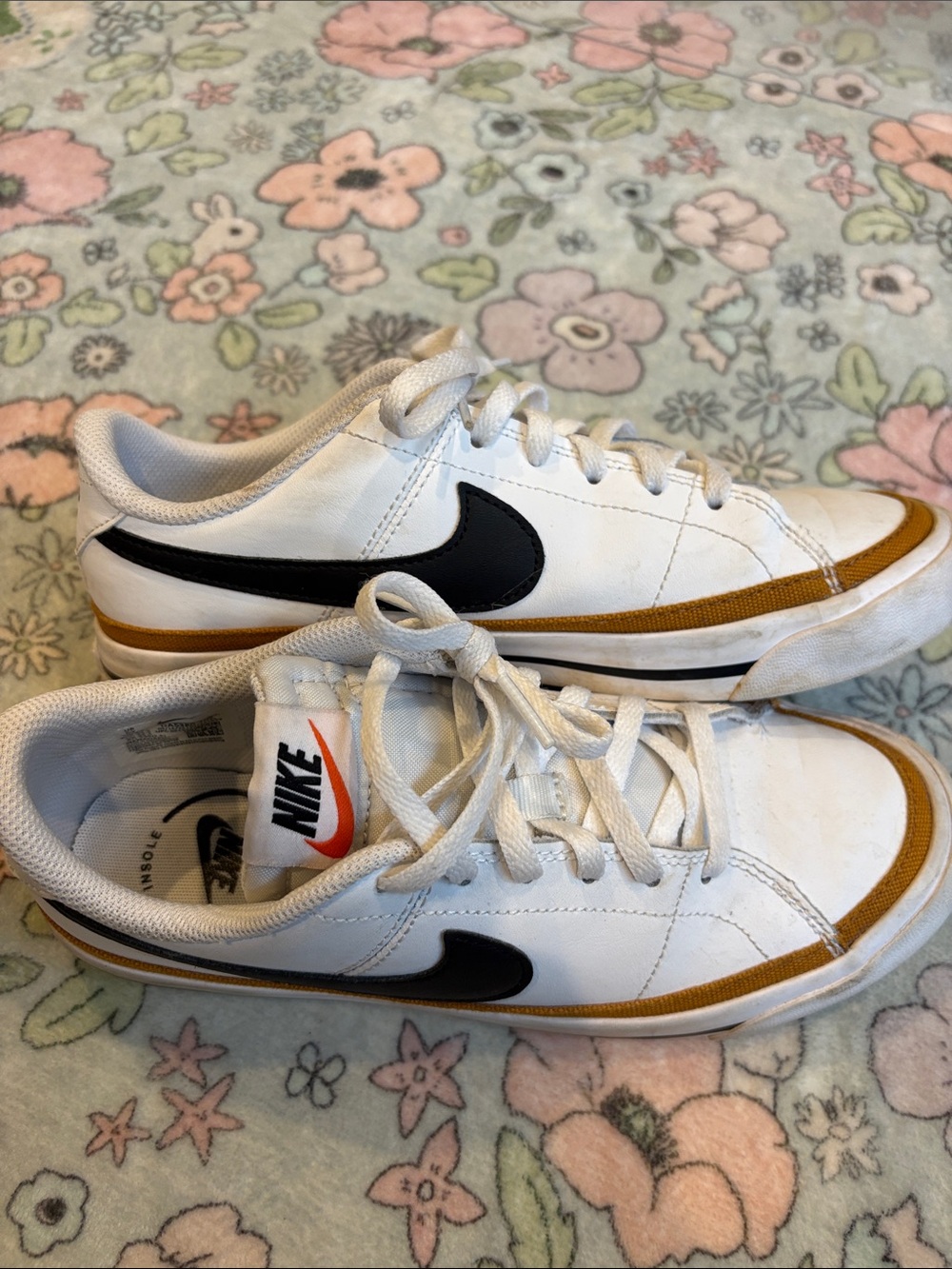 Nike Womans White Sneakers with Black Swoosh and Gold Trim